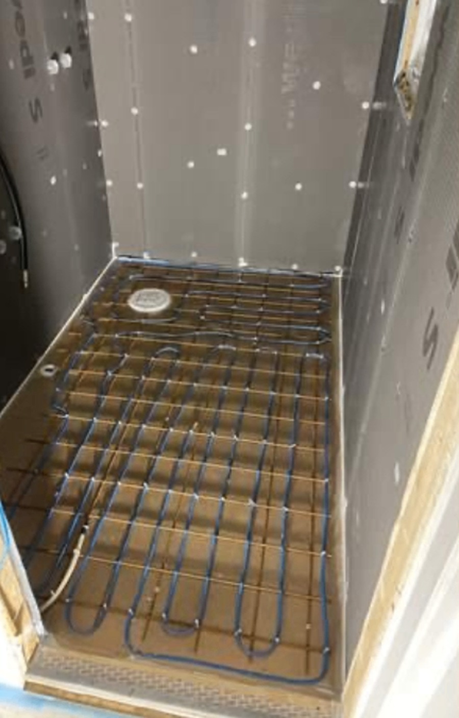 Underfloor heated shower room before