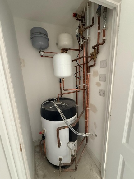 Cylinder in a bare cupboard after